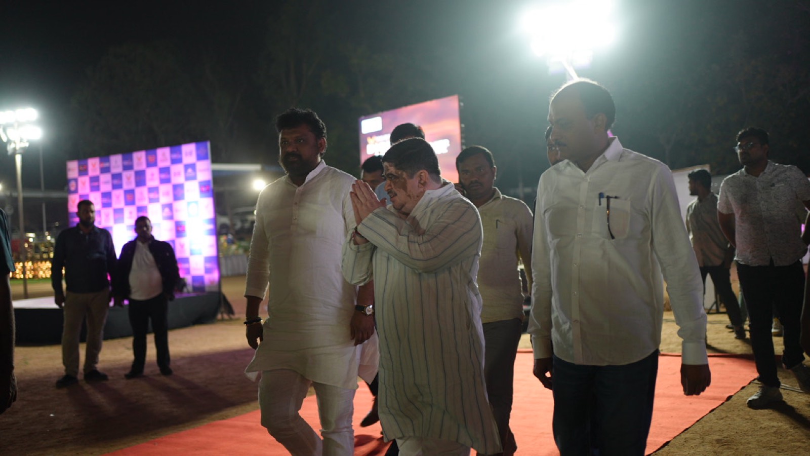 Guests arriving at the ground at night