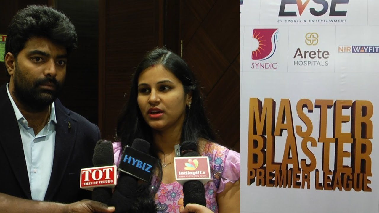 Guests interviewed by the media in front of the Master Blaster Premier League backdrop